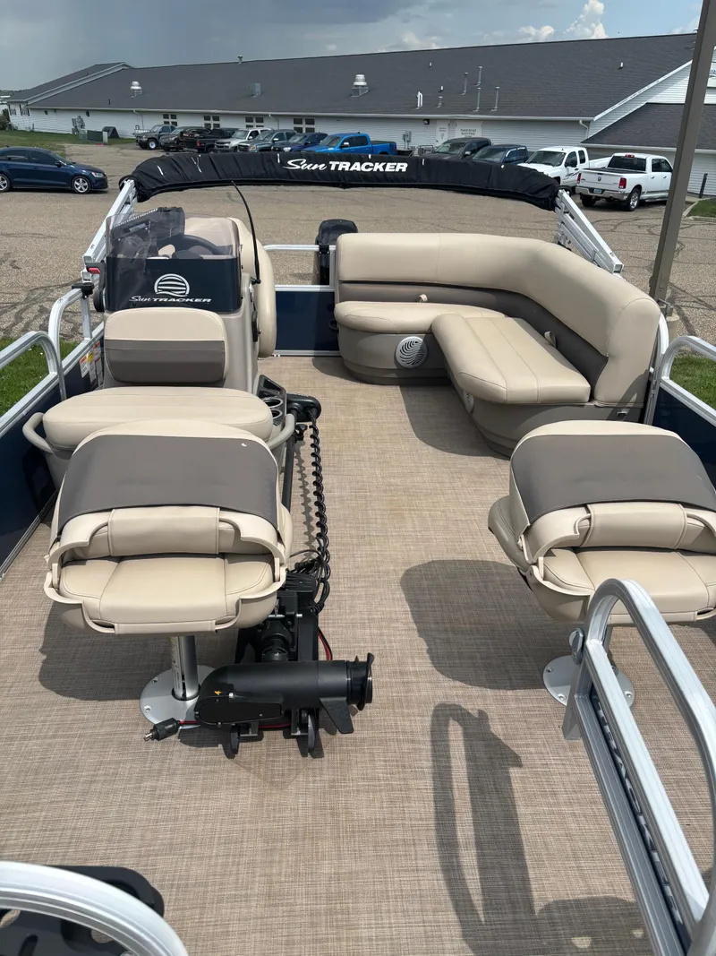 Slide: The Image of 2022 Sun Tracker Bass Buggy 16 XL Select pontoon boat with beige seating and spacious deck. - 4