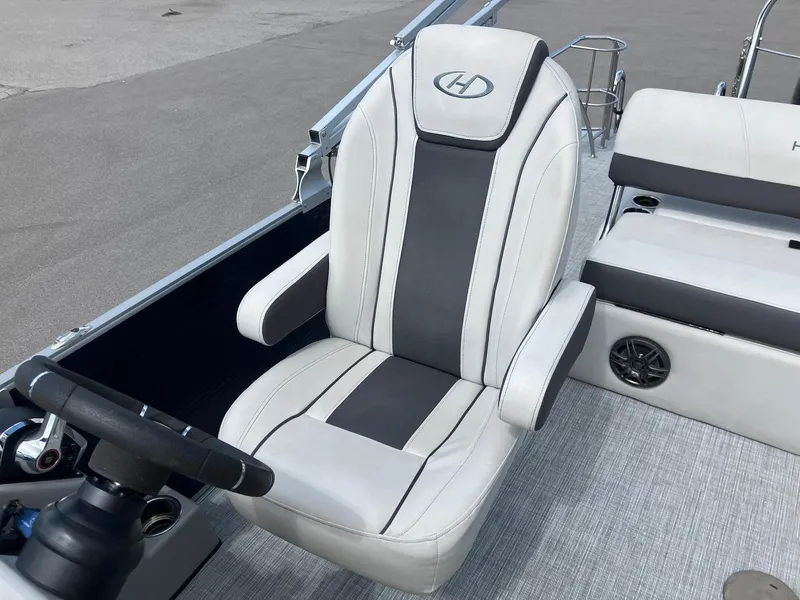 Slide: The Image of Captain's seat on 2023 Harris Cruiser 230 boat, featuring sleek design and comfortable upholstery. - 12