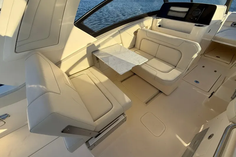 Slide: The Image of Luxurious seating area on 2026 Scout 277 Dorado boat with elegant table and upholstery. - 20