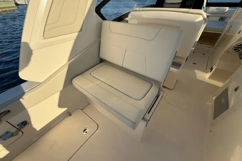 Slide: The Image of 2026 Scout 277 Dorado boat interior with beige seating and sleek design. - 21