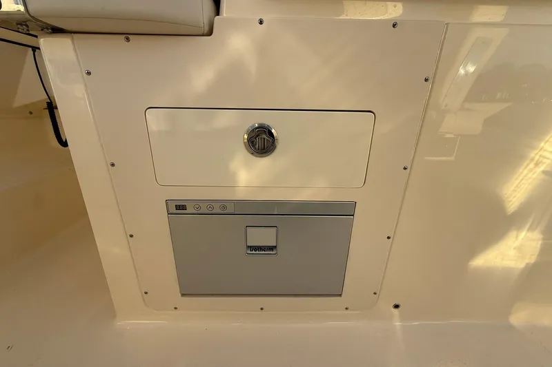 Slide: The Image of 2026 Scout 277 Dorado boat interior with built-in storage compartment. - 24