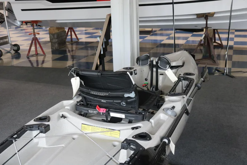 Slide: The Image of 2023 Hobie Mirage Outback kayak displayed indoors, featuring adjustable seating and storage compartments. - 4