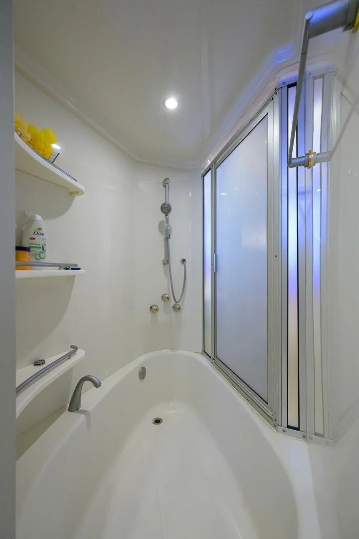 Slide: The Image of Luxurious bathroom in 2005 Marquis 65 MY yacht with modern fixtures and shelving. - 21