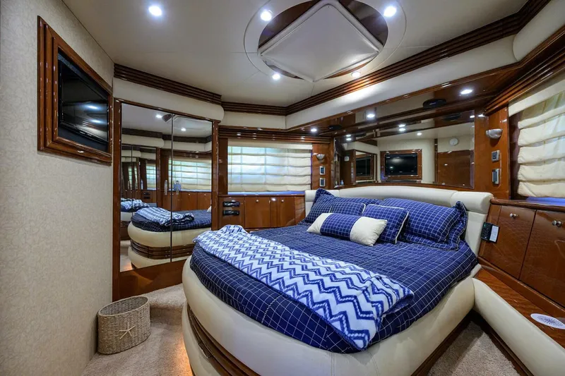 Slide: The Image of Luxurious bedroom interior of 2005 Marquis 65 MY yacht with elegant bedding and wood accents. - 23