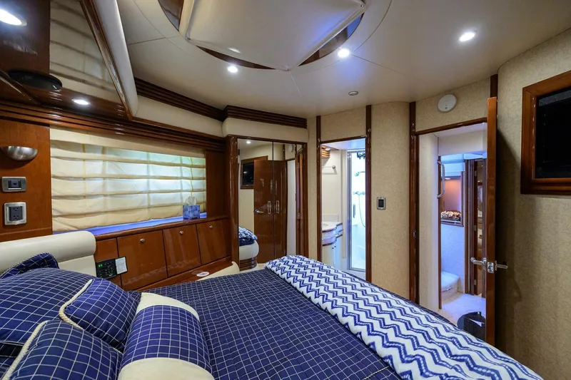 Slide: The Image of Luxurious bedroom interior of 2005 Marquis 65 MY yacht with elegant bedding and wood accents. - 24