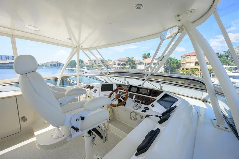 Slide: The Image of Luxurious 2005 Marquis 65 MY yacht helm with modern controls and panoramic views. - 37