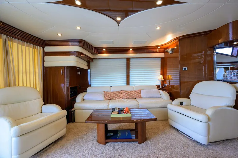 Slide: The Image of Luxurious interior of a 2005 Marquis 65 MY yacht with plush seating and elegant decor. - 6