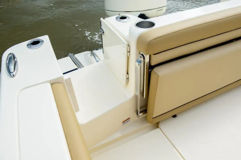 Slide: The Image of 2026 Scout 215 XSF boat interior with foldable seating and Mercury engine. - 19
