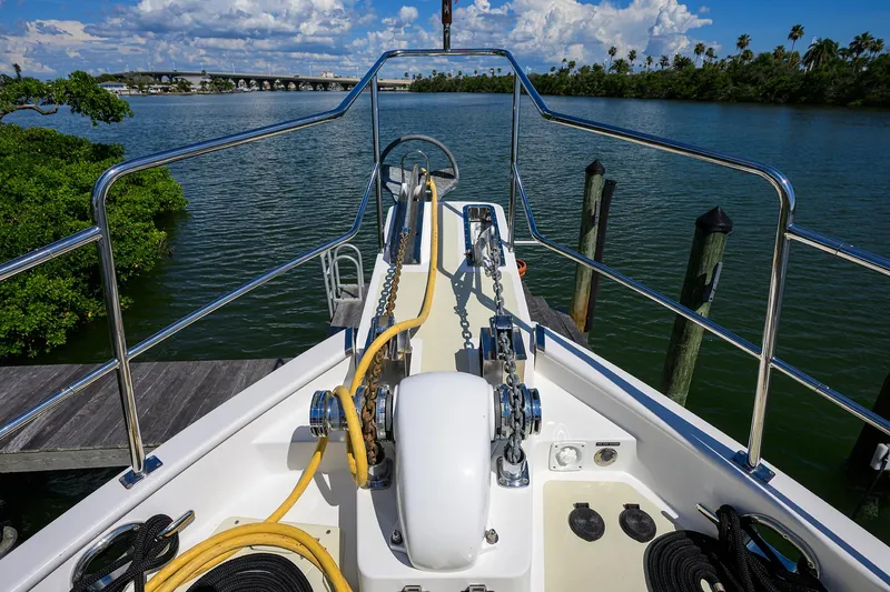 Slide: The Image of Bow view of 2013 Krogen 44' AE Widebody yacht docked by serene waters. - 28