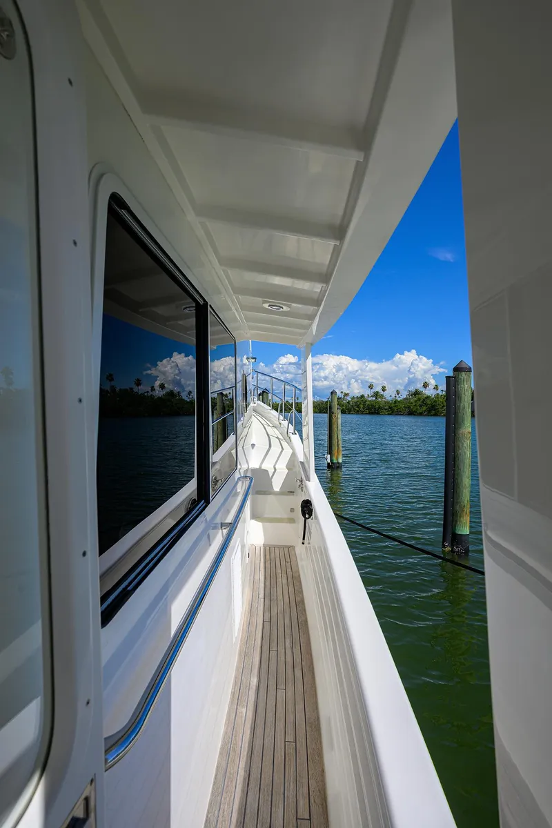 Slide: The Image of 2013 Krogen 44' AE Widebody yacht deck with ocean view and clear blue sky. - 33