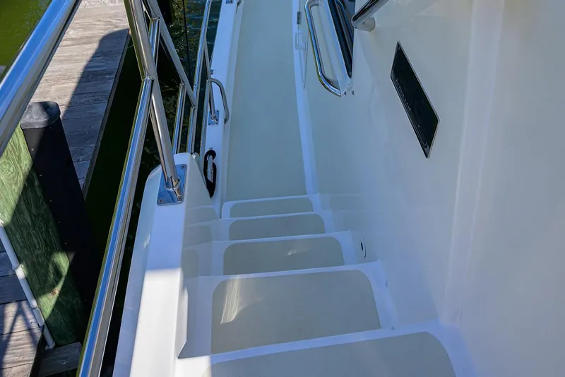 Slide: The Image of Stairway on 2013 Krogen 44' AE Widebody yacht with stainless steel railings. - 40