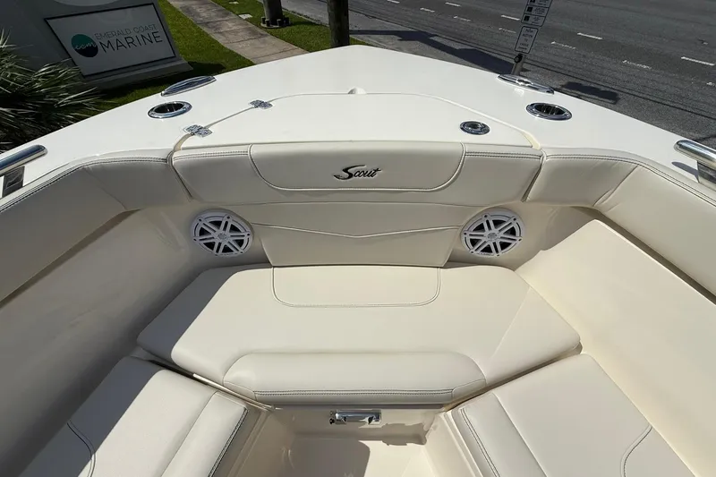 Slide: The Image of 2026 Scout 240 XSF boat interior with cushioned seating and marine speakers. - 14