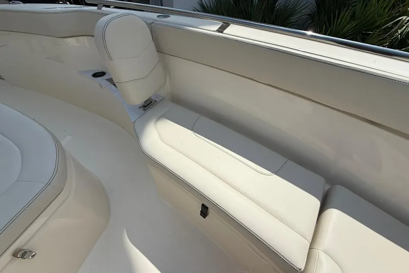 Slide: The Image of 2026 Scout 240 XSF boat interior with white seating and sleek design. - 15