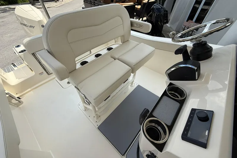 Slide: The Image of 2026 Scout 240 XSF boat cockpit with dual seats and modern controls. - 22