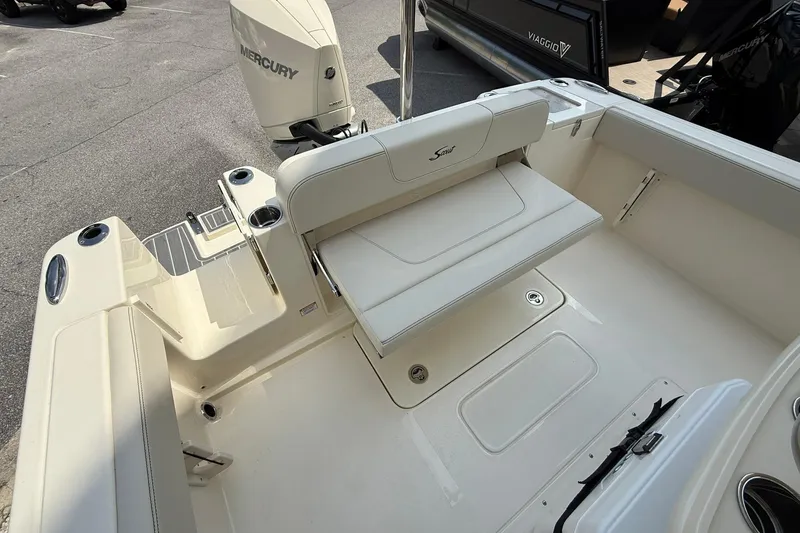 Slide: The Image of 2026 Scout 240 XSF boat interior with seating and Mercury engine. - 27