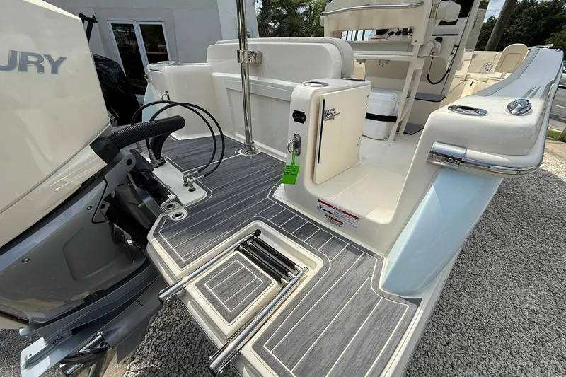 Slide: The Image of 2026 Scout 240 XSF boat with sleek deck and Mercury engine. - 32