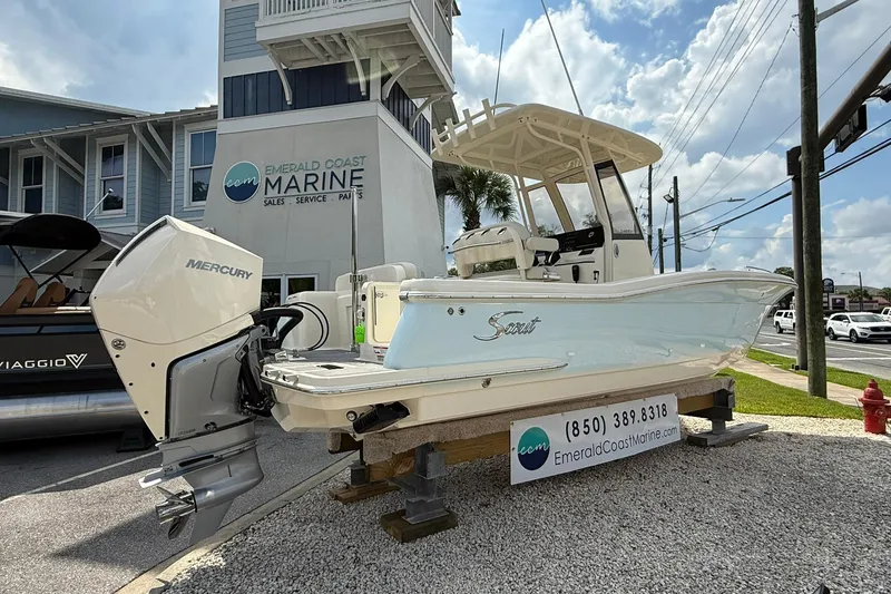Slide: The Image of 2026 Scout 240 XSF boat displayed at Emerald Coast Marine dealership. - 5