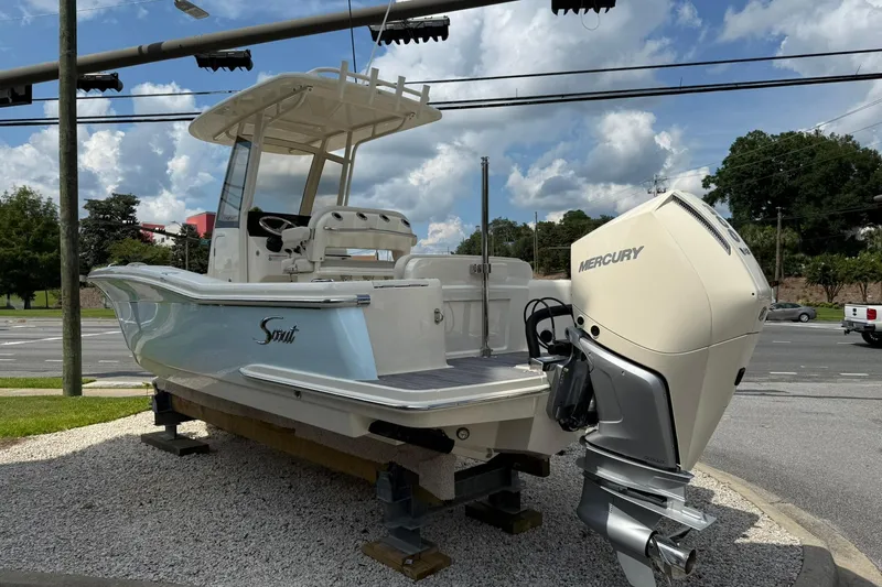Slide: The Image of 2026 Scout 240 XSF boat with Mercury engine displayed outdoors. - 7