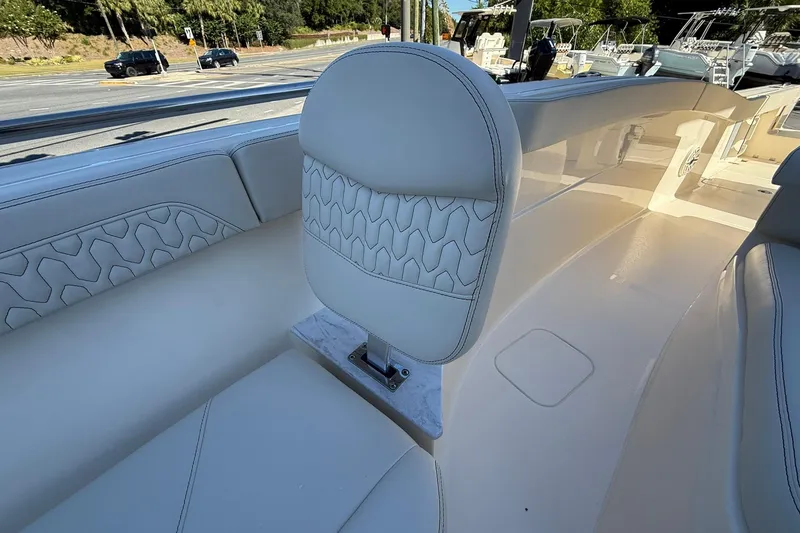 Slide: The Image of Luxury seating on 2026 Scout 260 LXF boat, featuring elegant white upholstery. - 11