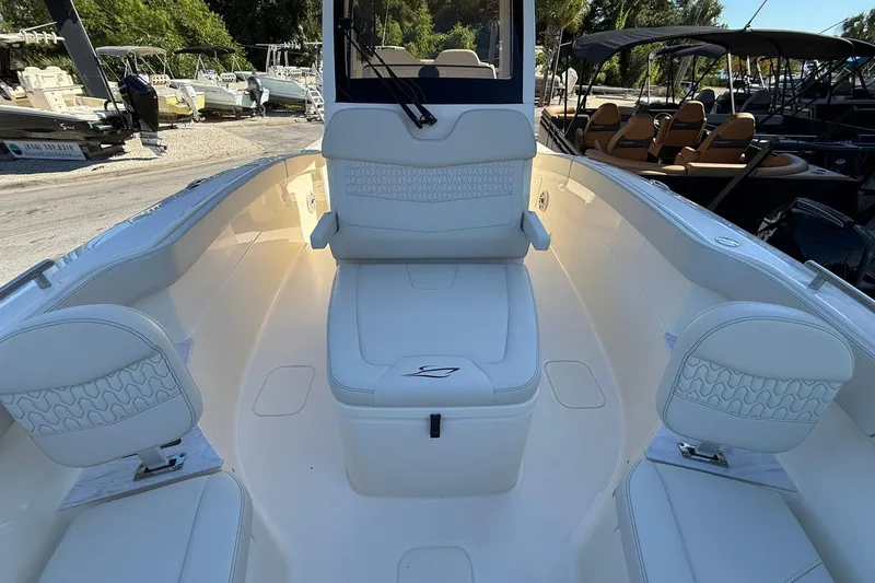 Slide: The Image of 2026 Scout 260 LXF boat interior with white seating and modern design. - 13