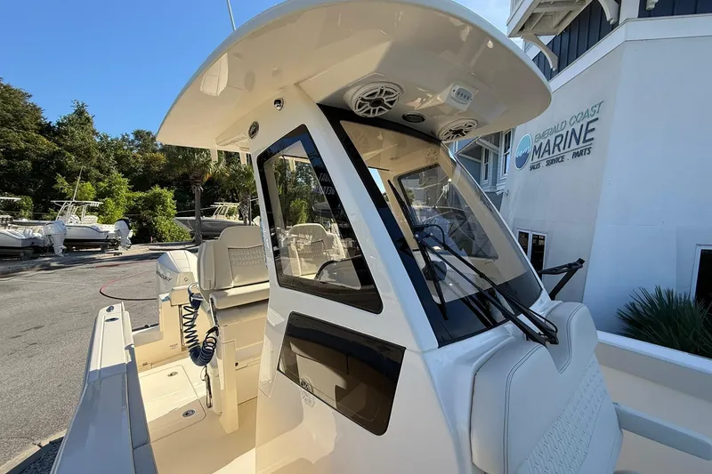 Slide: The Image of 2026 Scout 260 LXF boat at Emerald Coast Marine dealership. - 15