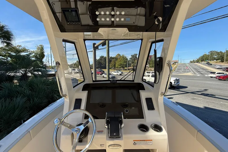 Slide: The Image of 2026 Scout 260 LXF boat cockpit with steering wheel and control panel. - 19
