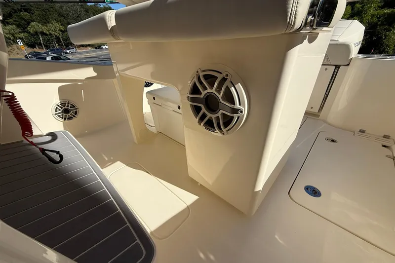 Slide: The Image of 2026 Scout 260 LXF boat interior with speakers and seating. - 22
