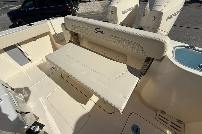 Slide: The Image of 2026 Scout 260 LXF boat interior with foldable seating and dual Mercury engines. - 32
