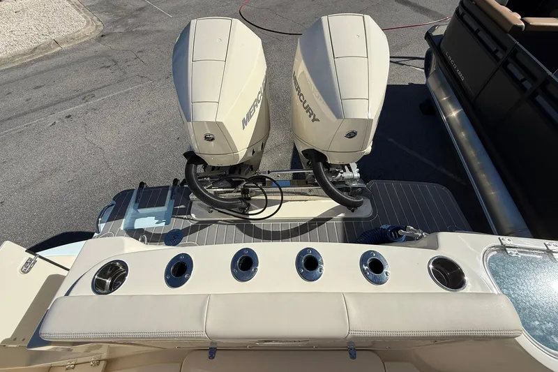 Slide: The Image of 2026 Scout 260 LXF boat with dual Mercury outboard engines, rear view. - 36