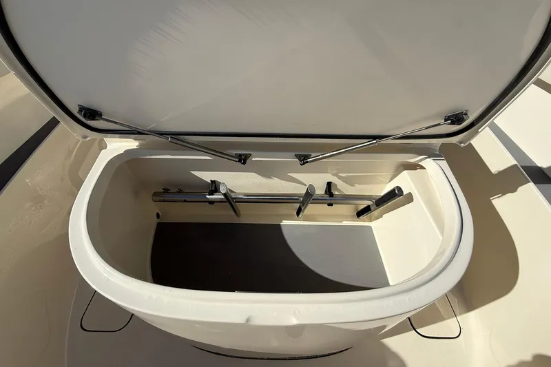 Slide: The Image of Open storage compartment on 2026 Scout 357 LXF boat, showcasing interior features. - 12
