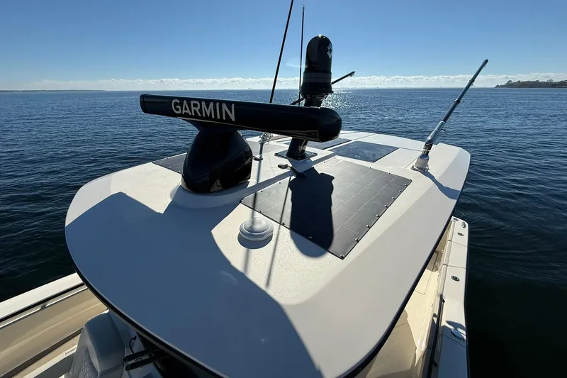Slide: The Image of 2026 Scout 357 LXF boat with Garmin radar on calm ocean waters. - 14