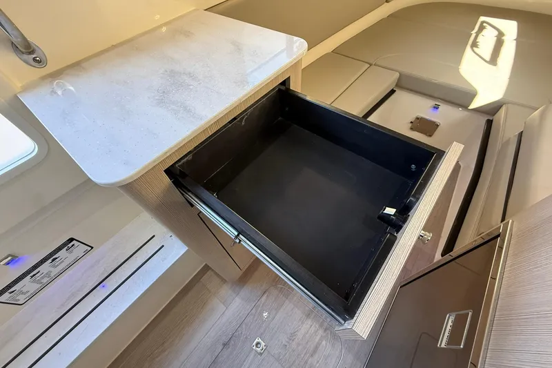 Slide: The Image of 2026 Scout 357 LXF interior with open drawer and modern design. - 18
