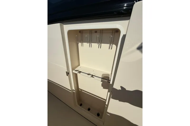 Slide: The Image of Fishing rod storage compartment on 2026 Scout 357 LXF boat. - 23
