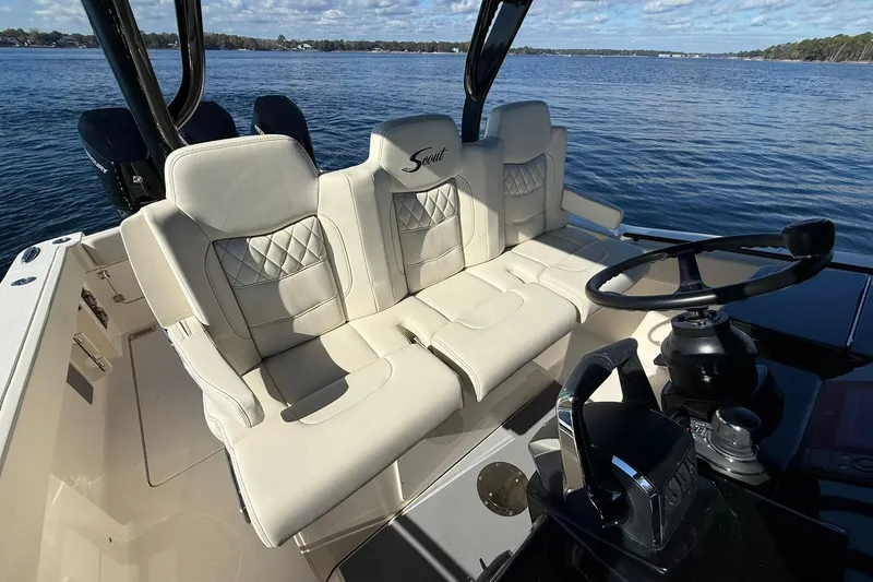 Slide: The Image of Luxury seating on 2026 Scout 357 LXF boat with scenic water view. - 24