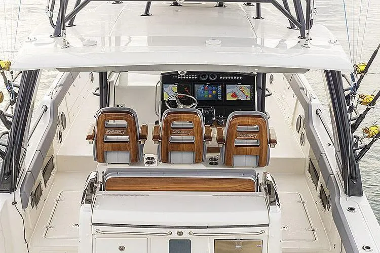 Slide: The Image of Luxurious interior of 2026 Boston Whaler 420 Outrage with modern amenities and sleek design. - 25