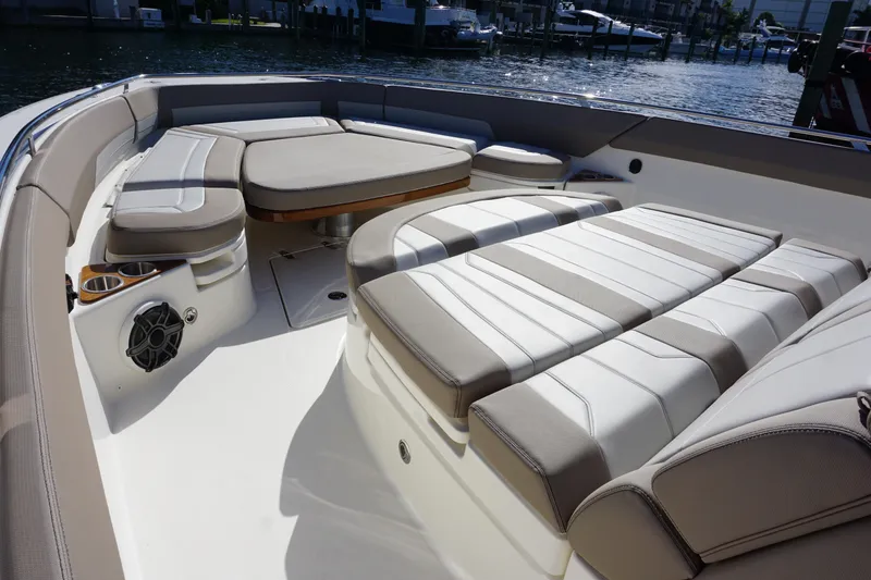 Slide: The Image of 2026 Boston Whaler 420 Outrage boat interior with open storage compartment and seating. - 33