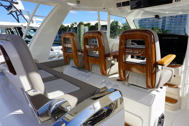 Slide: The Image of 2026 Boston Whaler 420 Outrage boat deck with speakers and sleek design. - 38