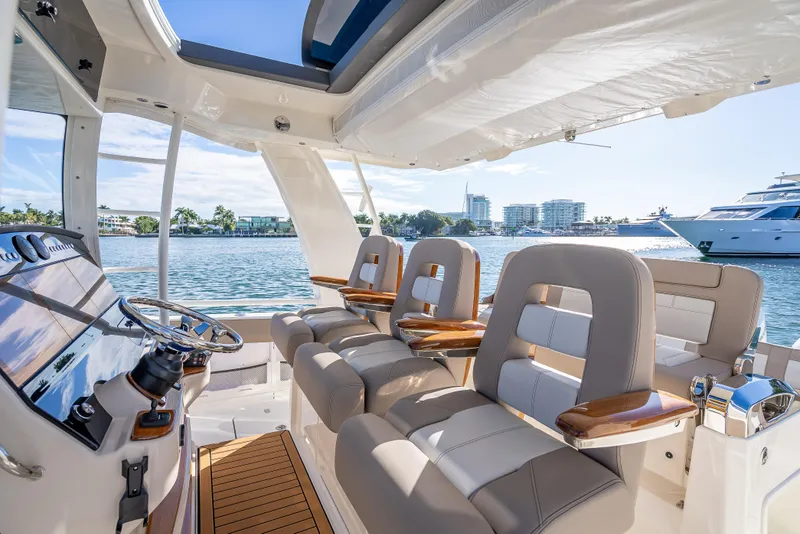 Slide: The Image of Luxurious interior of 2026 Boston Whaler 420 Outrage yacht with waterfront view. - 44