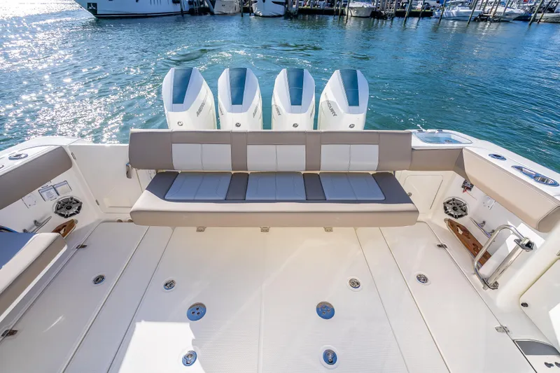 Slide: The Image of 2026 Boston Whaler 420 Outrage boat with spacious seating and four powerful engines. - 51