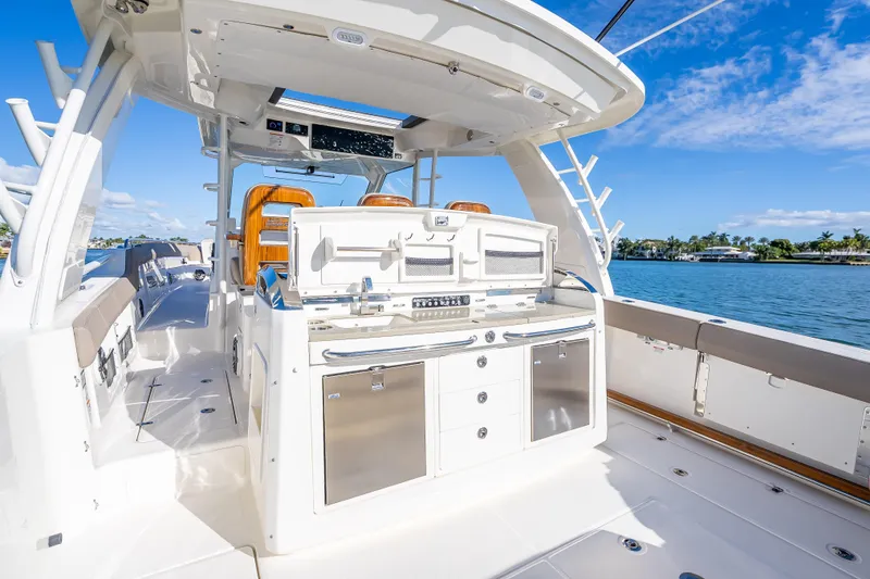 Slide: The Image of 2026 Boston Whaler 420 Outrage boat interior with sleek design and modern amenities. - 56