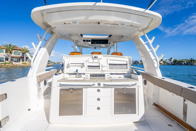 Slide: The Image of 2026 Boston Whaler 420 Outrage boat interior with sleek design and modern amenities. - 57