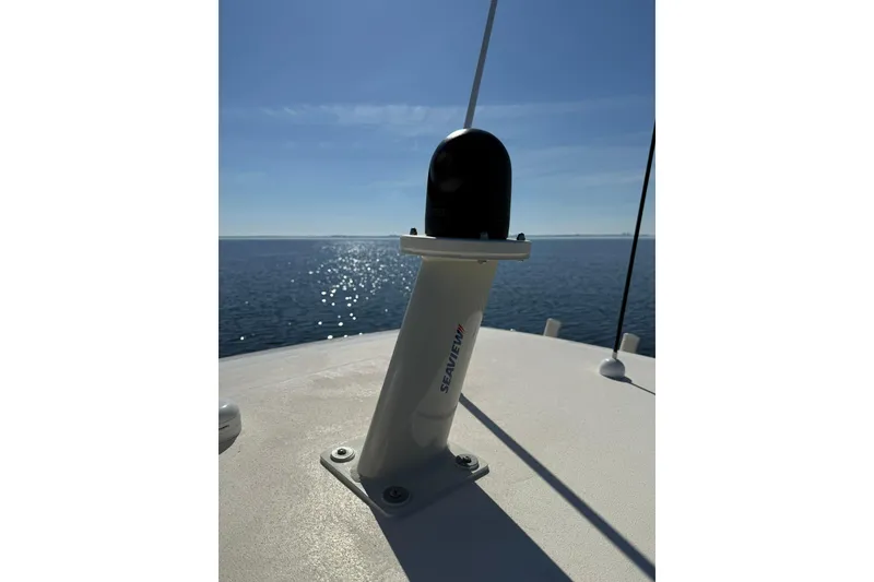 Slide: The Image of Antenna on 2026 Scout 288 LXF boat, with ocean view and clear sky. - 18
