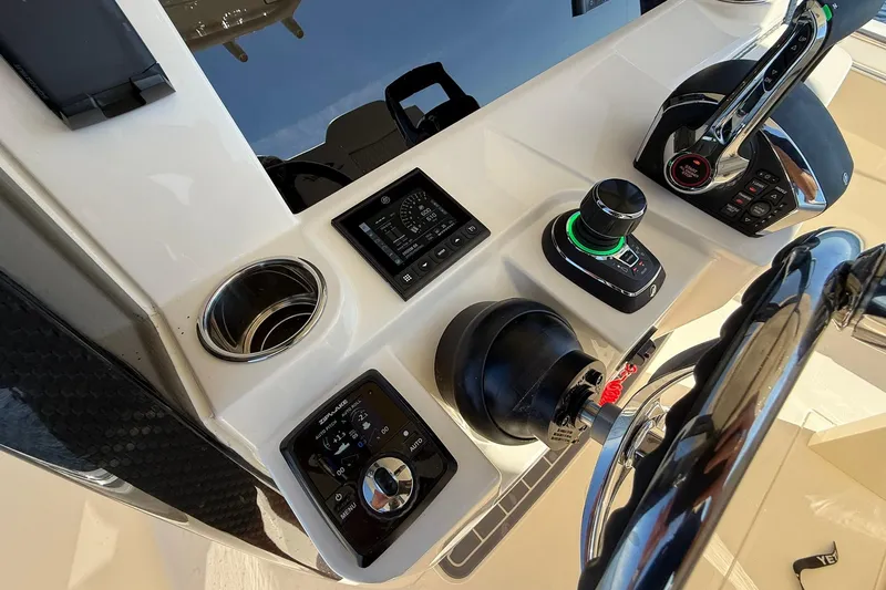 Slide: The Image of Control panel of 2026 Scout 288 LXF boat with advanced navigation features. - 29