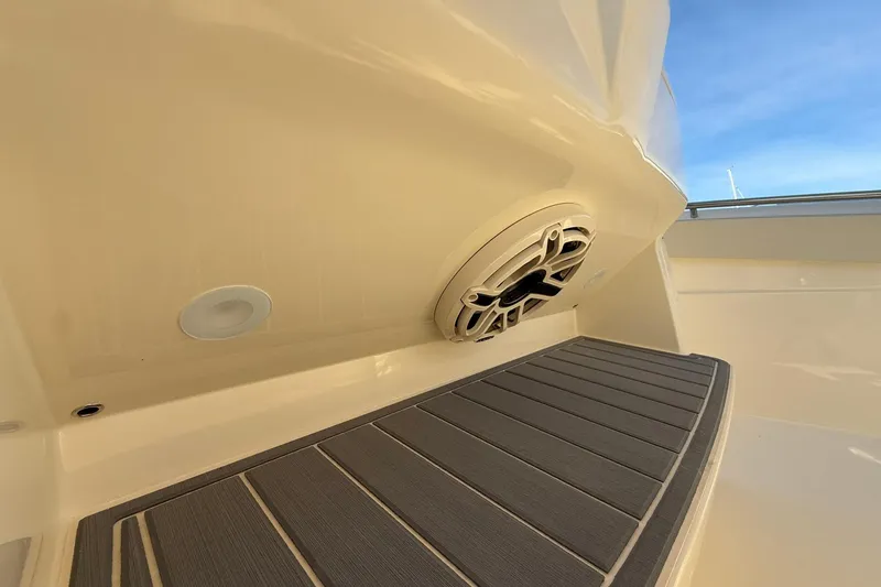 Slide: The Image of 2026 Scout 288 LXF boat interior with speaker and non-slip flooring. - 32