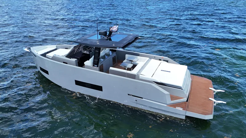The Image of 2021 De Antonio Yachts D42 luxury yacht on open water, showcasing sleek design and spacious deck. - 0
