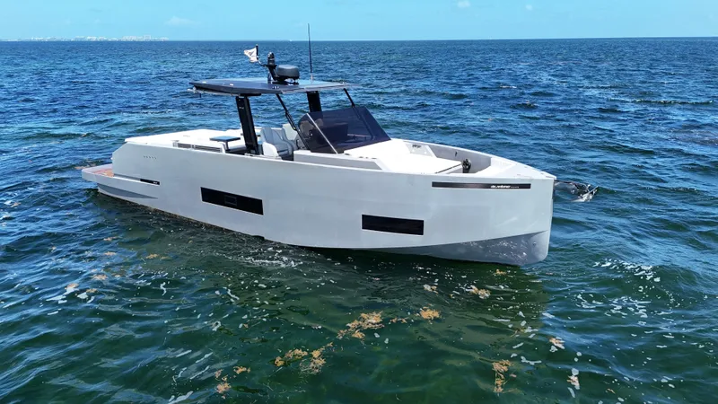 Slide: The Image of 2021 De Antonio Yachts D42 cruising on open water, showcasing sleek design and modern features. - 11