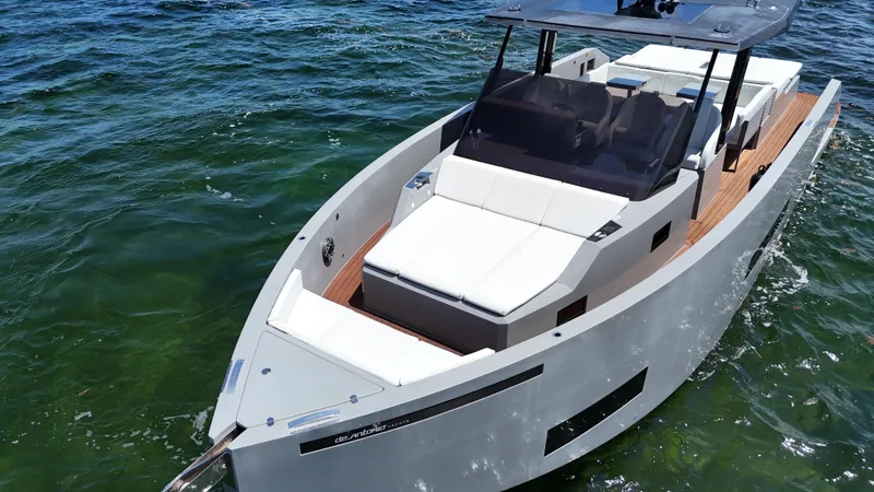 Slide: The Image of 2021 De Antonio Yachts D42 cruising on clear blue water. - 12