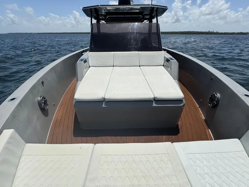 Slide: The Image of De Antonio Yachts D42 (2021) with spacious deck and seating on open water. - 17