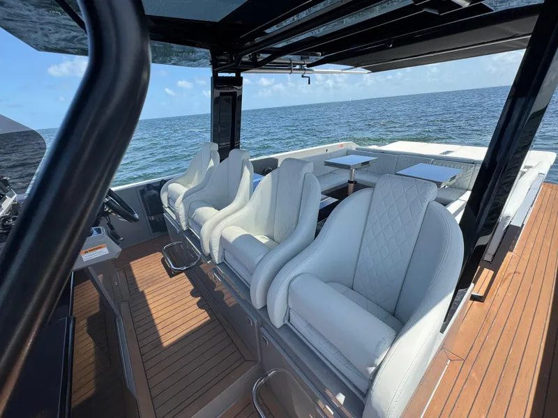 Slide: The Image of Luxurious 2021 De Antonio Yachts D42 interior with white seating and ocean view. - 19