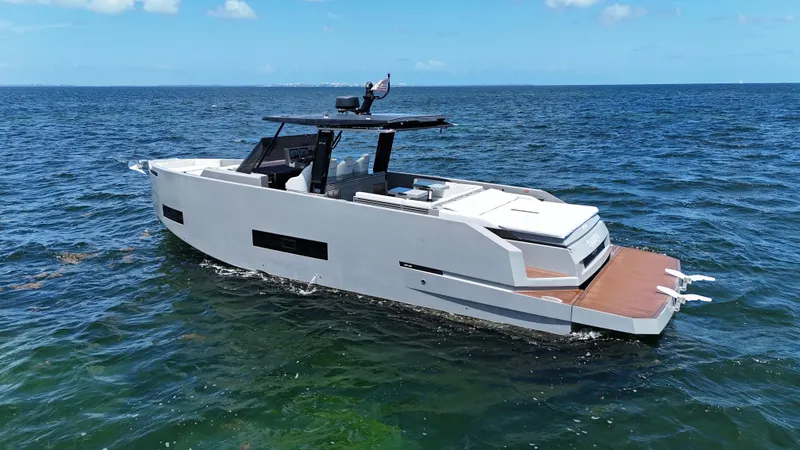 Slide: The Image of 2021 De Antonio Yachts D42 cruising on open water under clear skies. - 2